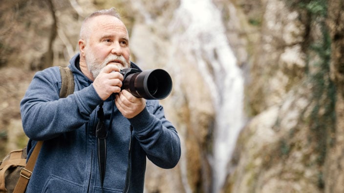 illustration of 3 people holding certificates